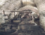 Abandoned brewery basement with a Pelton Water Wheel.